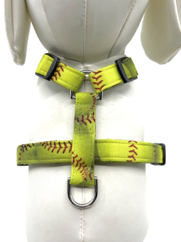 A harness with baseball stitching on it.