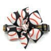 A black and white hair clip with baseball fabric.