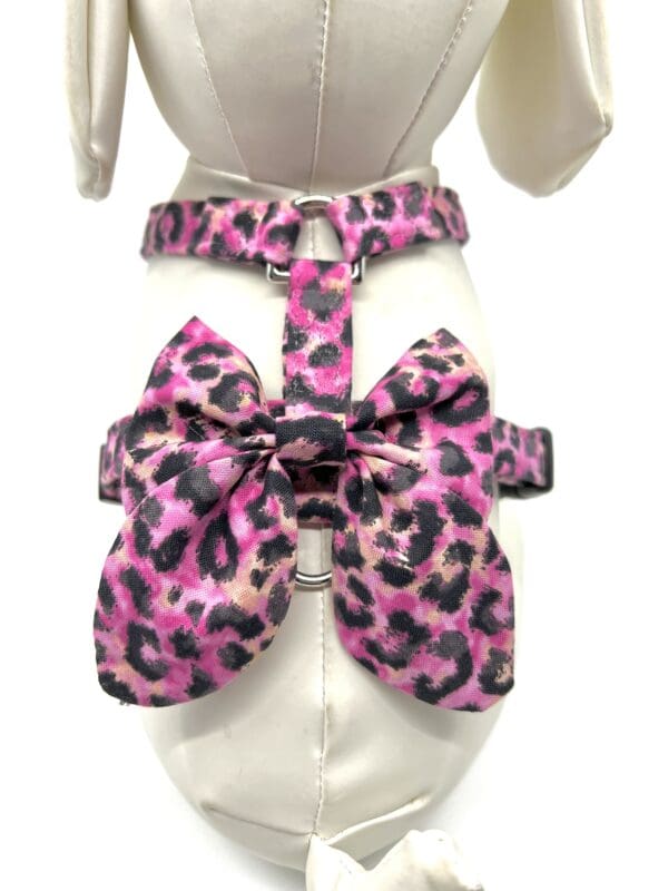 A mannequin with a pink leopard print bow tie.
