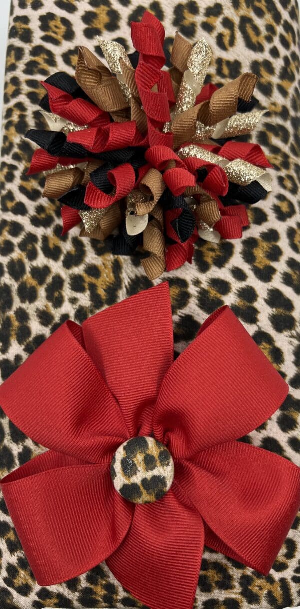 A red bow and leopard print background