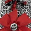A red bow and leopard print fabric