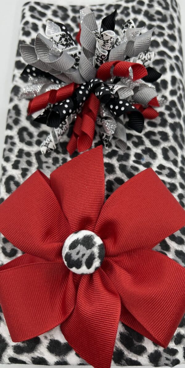 A red bow and leopard print fabric