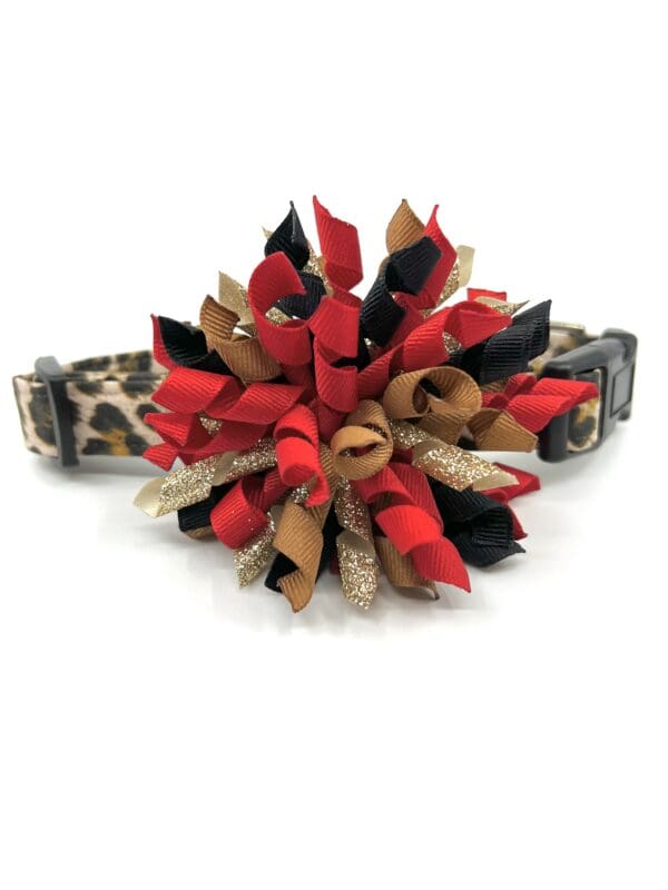 A red and black flower with leopard print collar