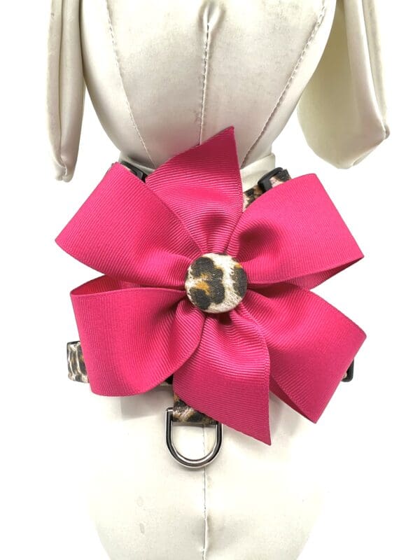 A pink bow with leopard print on it