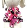A mannequin with pink and black bows on it.
