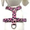 A pink leopard print harness with a white shirt