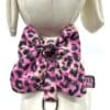 A pink and black leopard print bow tie on a dress