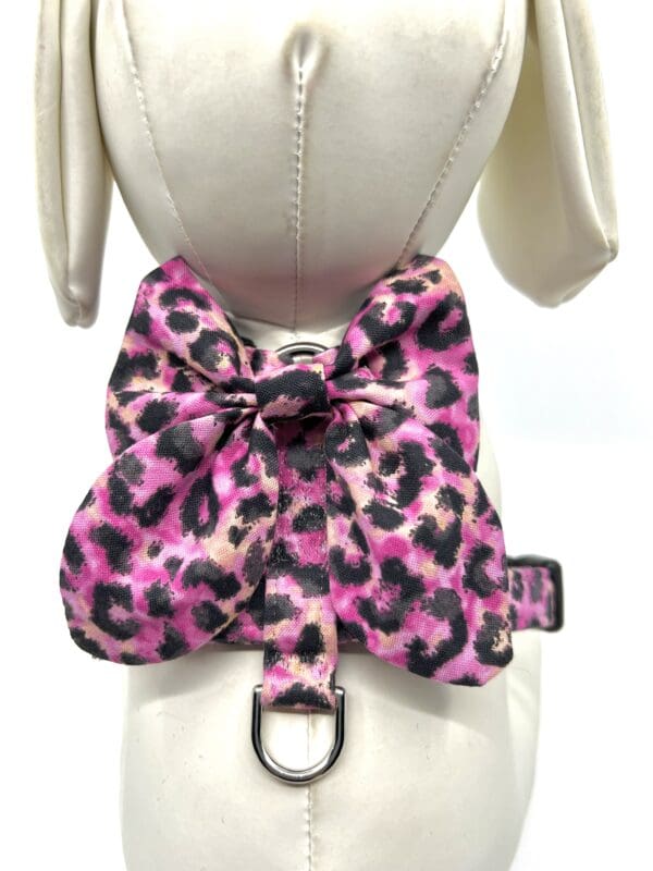A pink and black leopard print bow tie on a dress