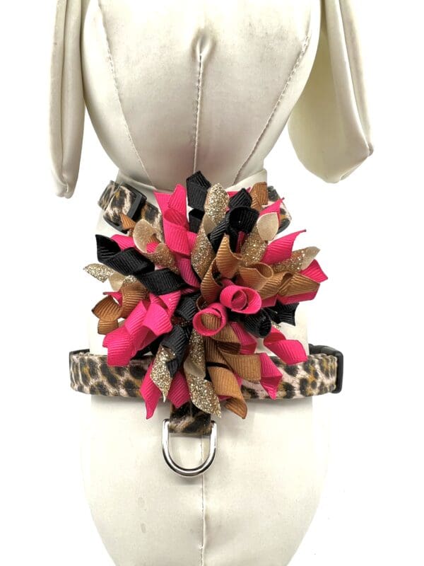 A dog 's harness with flowers on it