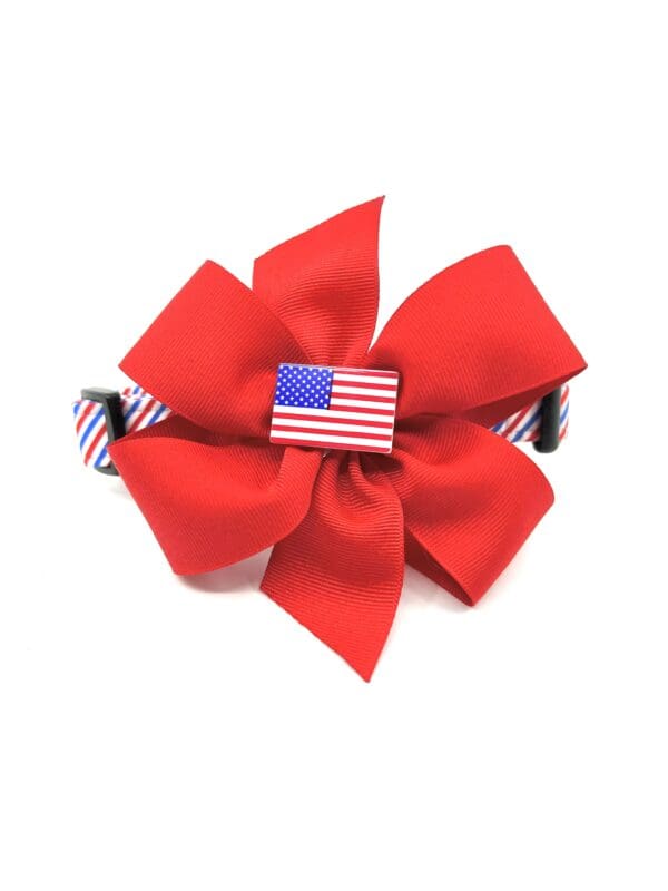 A red bow with an american flag on it.