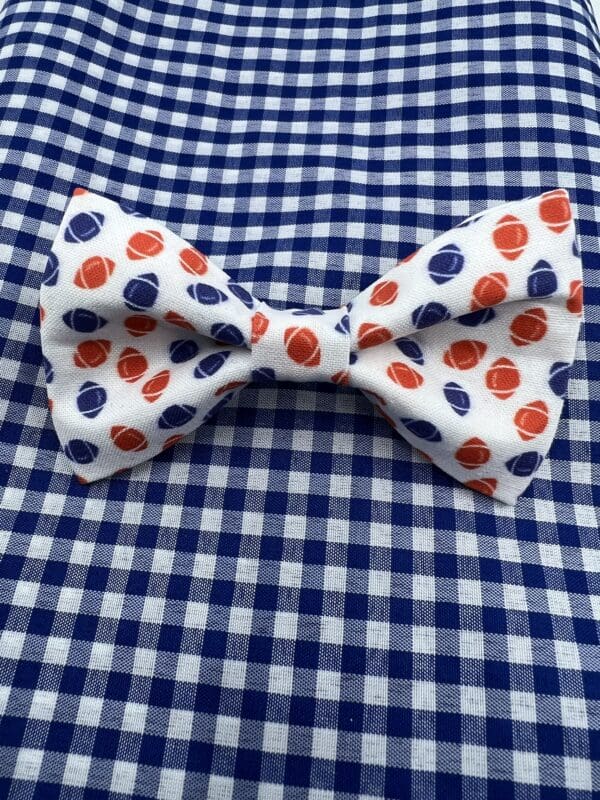 A bow tie with red and blue polka dots on it.