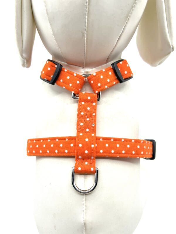 A harness with white polka dots on it.