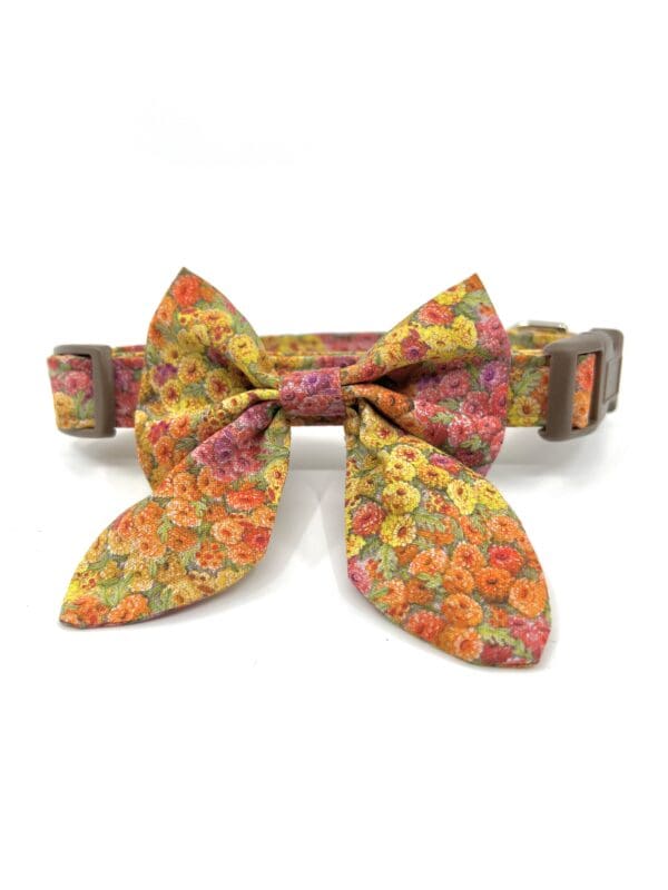 A bow tie collar with flowers on it