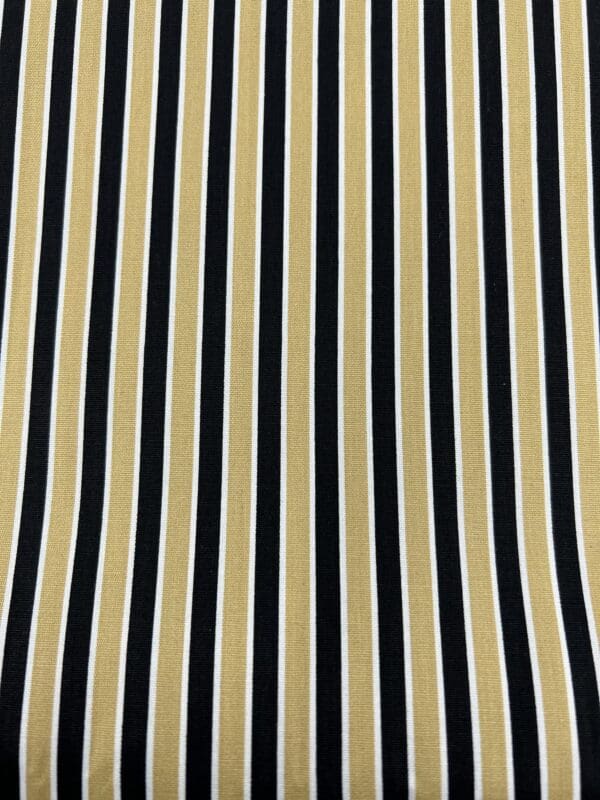 A black and white striped fabric background.