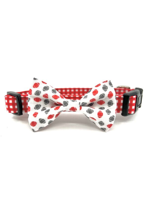 A red and white polka dot bow tie collar for dogs.