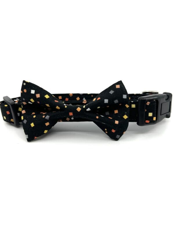 A black collar with a bow tie on it