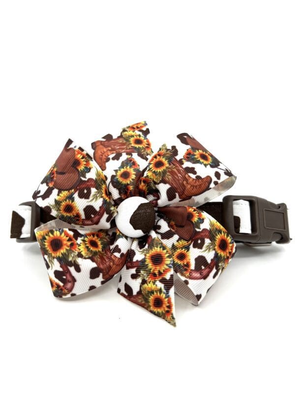 A dog collar with sunflowers and bears on it.