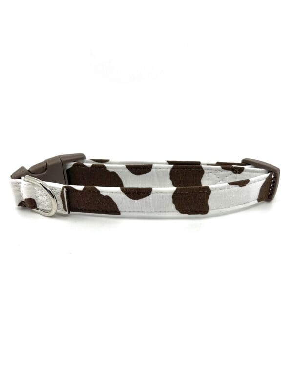 A black and white cow print dog collar.