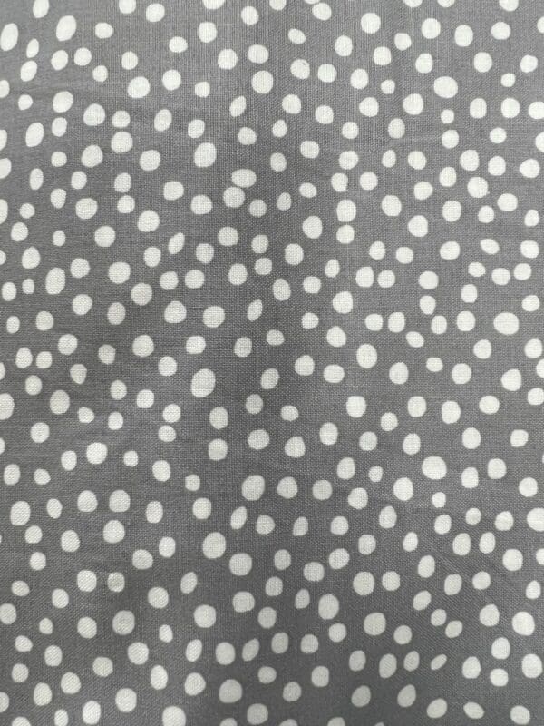 Grey and white polka dot fabric.