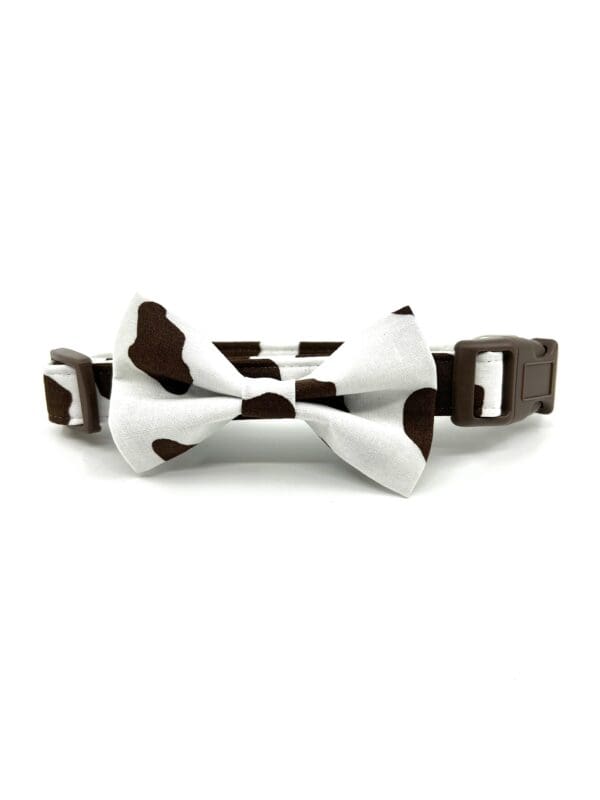 A brown and white cow print bow tie