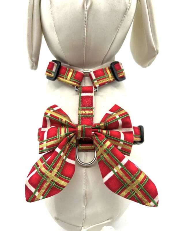 A mannequin wearing a plaid bow tie dog harness.