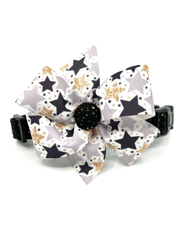 A black and white bow with stars on it.