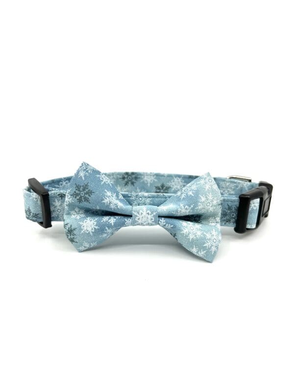 A dog collar with a blue snowflake print.
