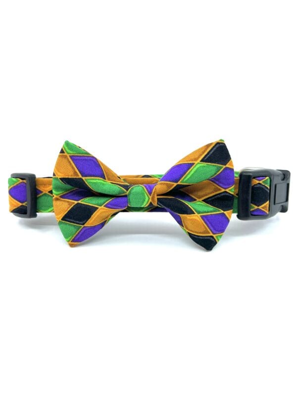 A bow tie with a purple, green and orange pattern.